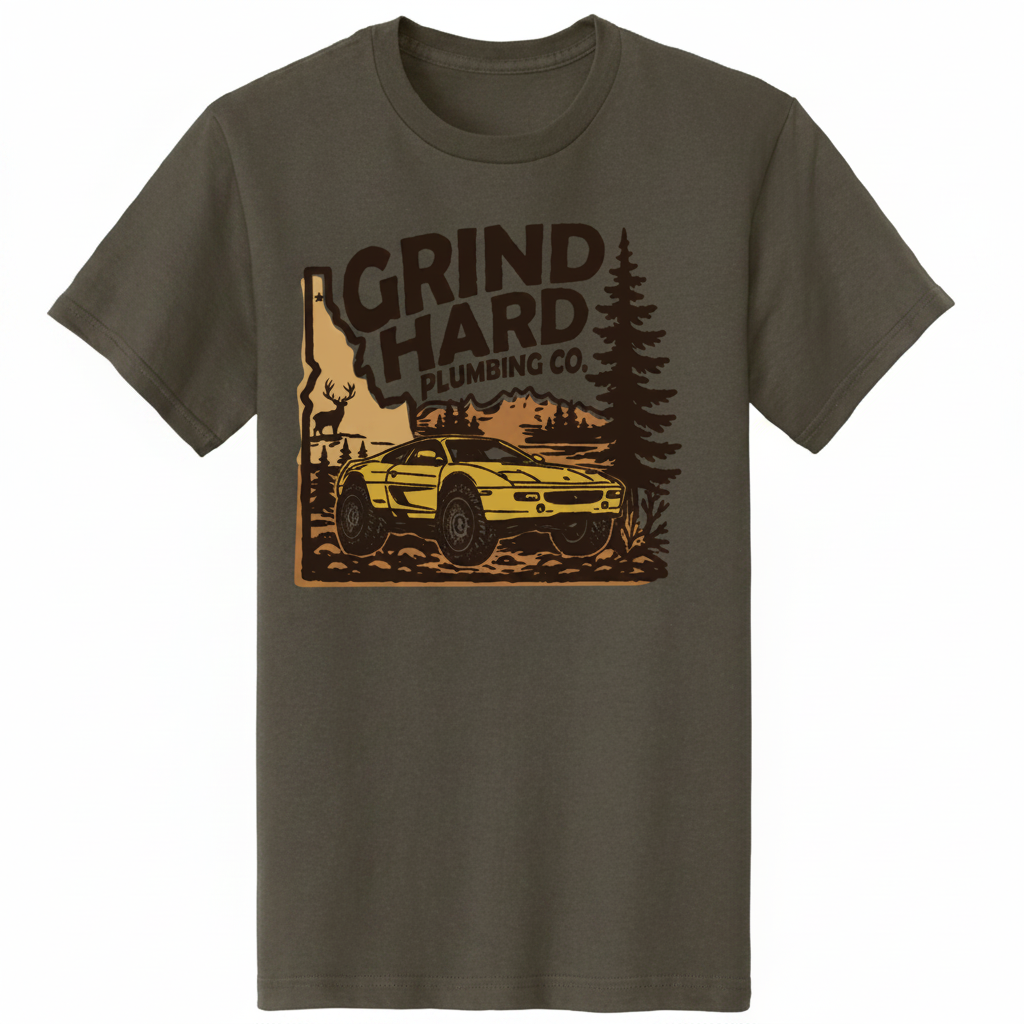 An olive green short-sleeve crewneck t-shirt featuring a vintage-style graphic print of a yellow off-road car, pine trees, and the text 'GRIND HARD PLUMBING CO.' on the front.
